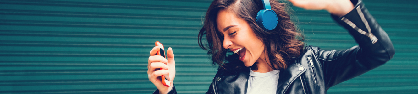 Woman dancing with headphones